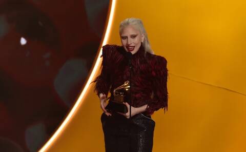 Lady Gaga accepts the award for Best Pop Vocal Album (Photo by VALERIE MACON / AFP via Getty Images)