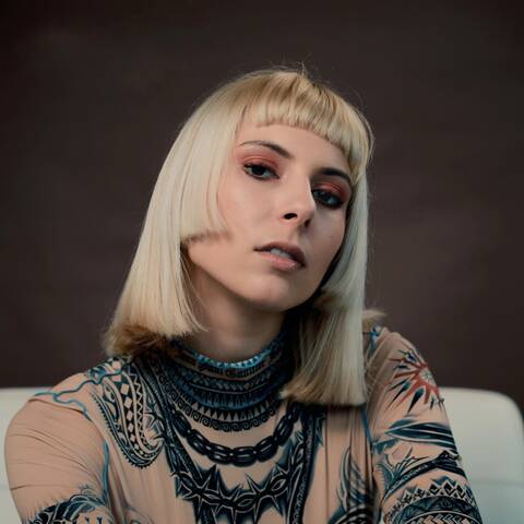 Marhu, a Belgian electronic music producer and DJ, in a dynamic press photo.