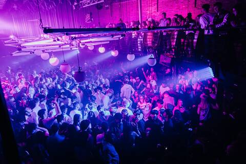 Crowd enjoying vibrant lights and music inside Ministry of Sound during the winter season 2024 event series